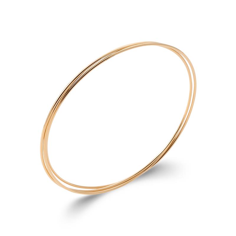 Drei ineinandergreifende vergoldete Armreifen – Eleganz im minimalistischen Design