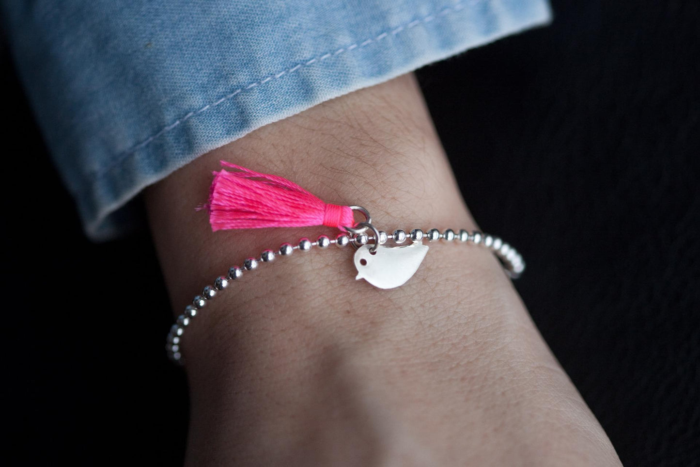 Kugelarmband mit Vogel-Anhänger und Quaste aus Silber