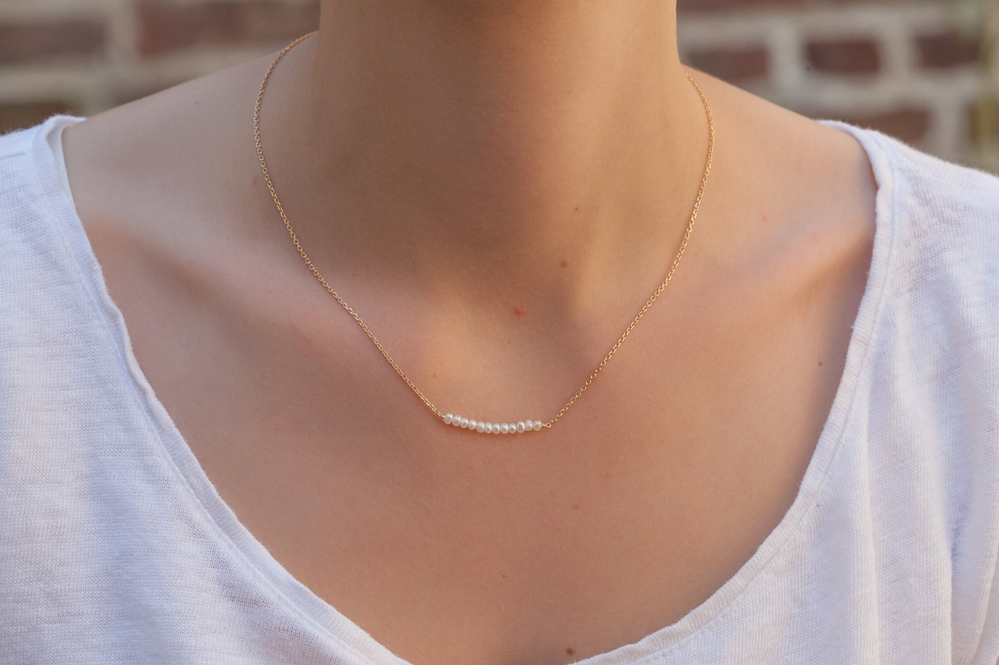 Kette mit 12 weißen Perlen - 16K vergoldet