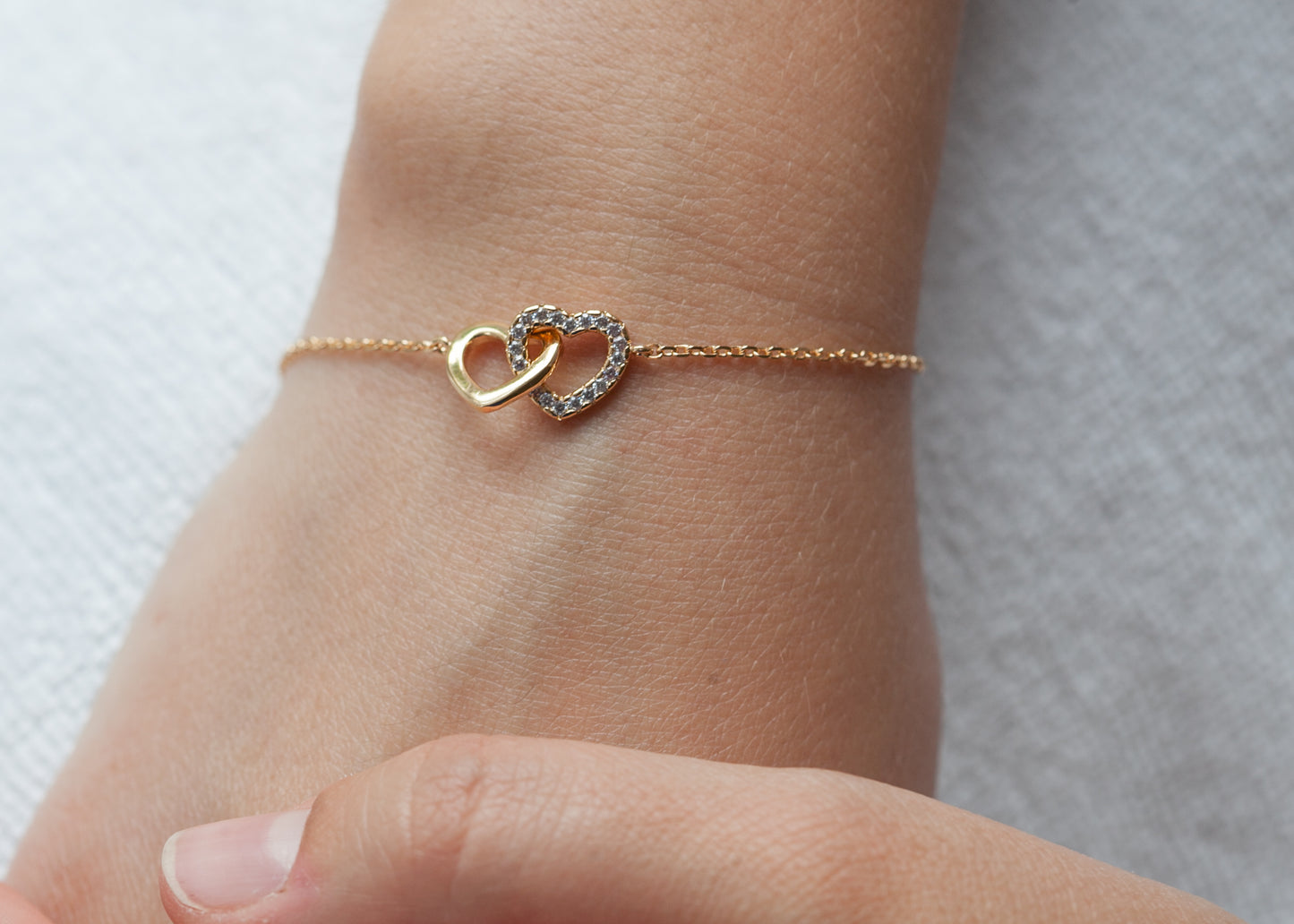 Armband zwei Herzen mit Zirkonia vergoldet