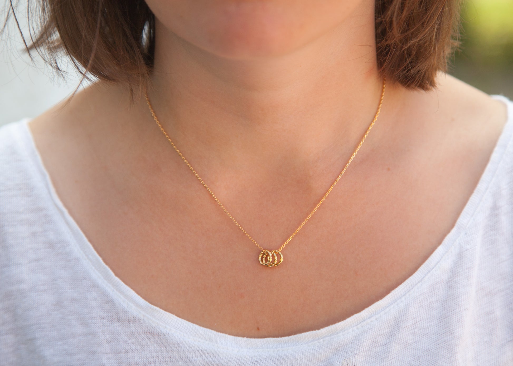 Kette mit 3 Ringen als Anhänger vergoldet