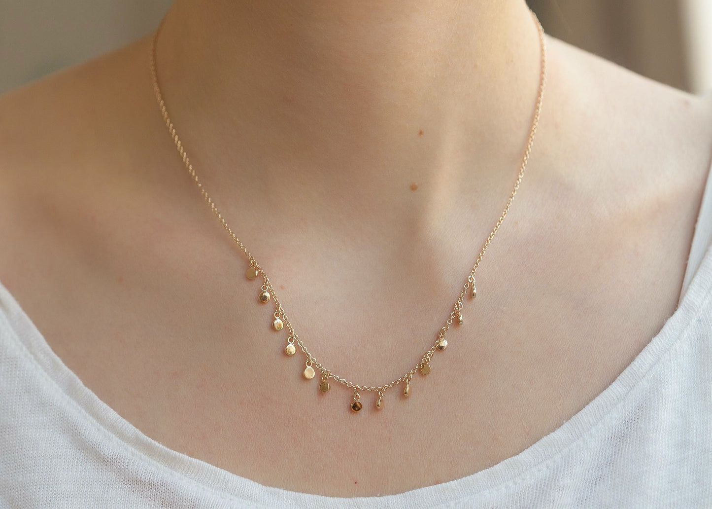 Kette mit 13 kleinen Plättchen 16Karat vergoldet