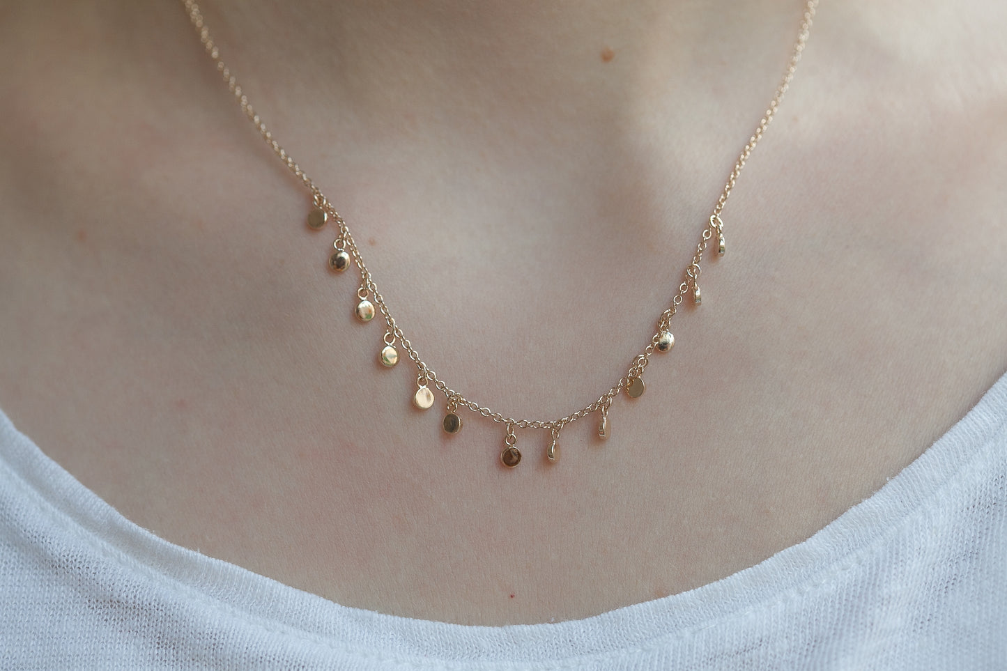 Kette mit 13 kleinen Plättchen 16Karat vergoldet